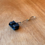 Rear view of a black TPU Anderson plug dust cover with 316 stainless steel retaining wire