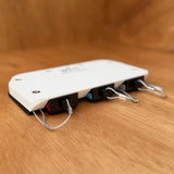 Anderson plug dust cover sliding onto SB50 plug, angled view